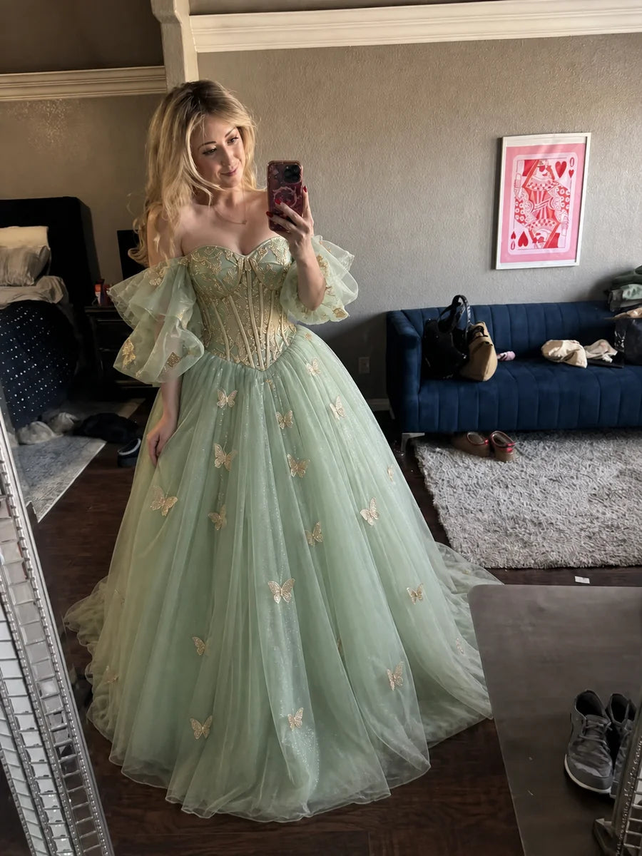 Real customer Lily K. trying on the Enchanted Butterfly Gown at home in everyday room light