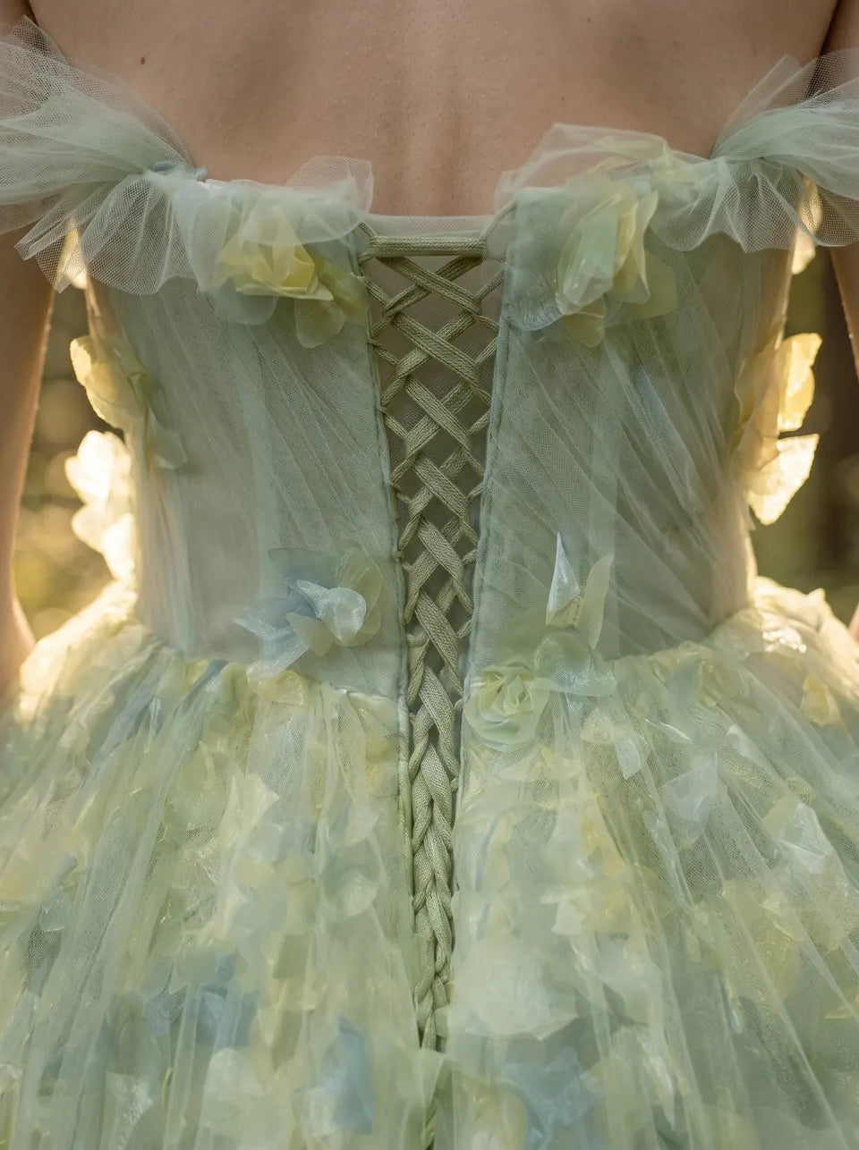 Close detail of a pale green tulle corset dress